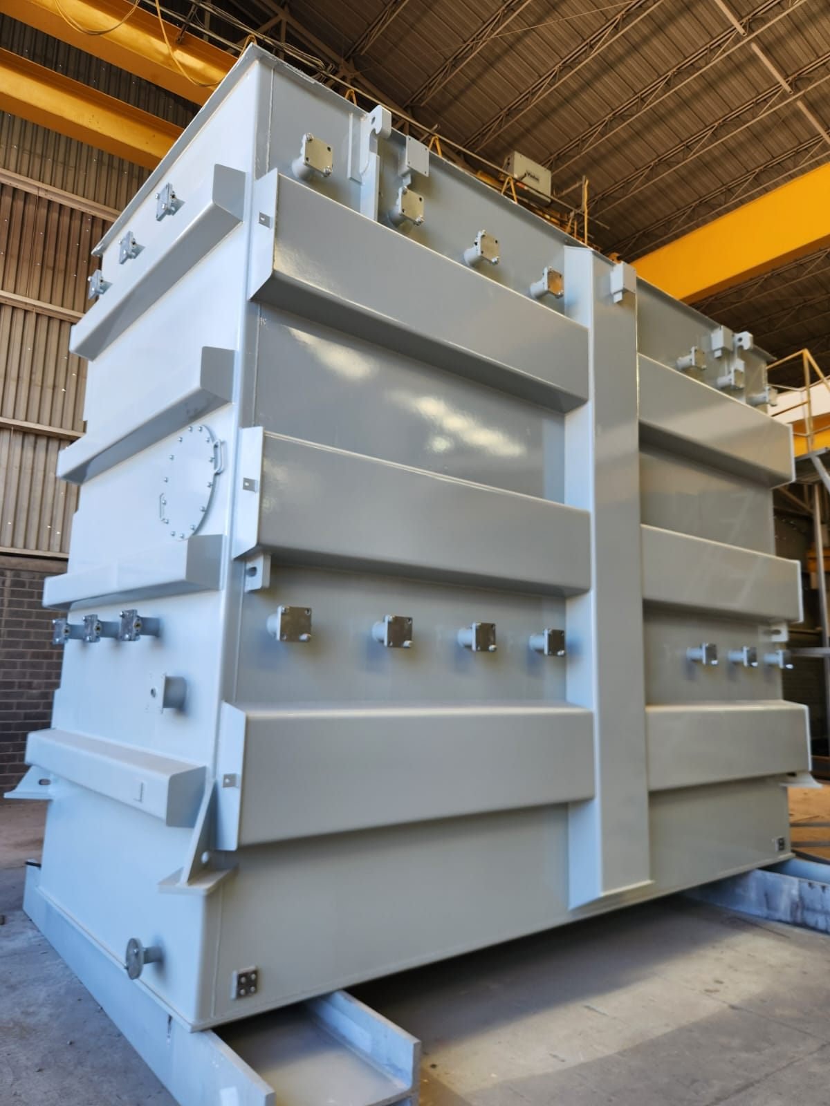Primed transformer tank with stiffeners and flanges